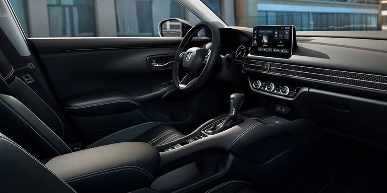 2027 Honda HR-V EX-L interior dashboard, steering wheel, and front seats (Subcompact Crossover SUV).